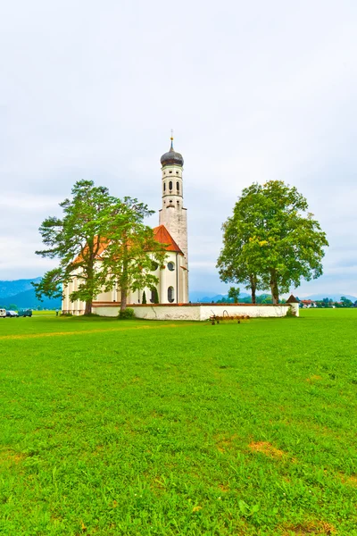 Typical bavarian or austrian landscape with a chape — Stock Photo, Image