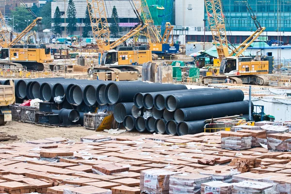 Huge water pipes are stored at the building site — Stock Photo, Image