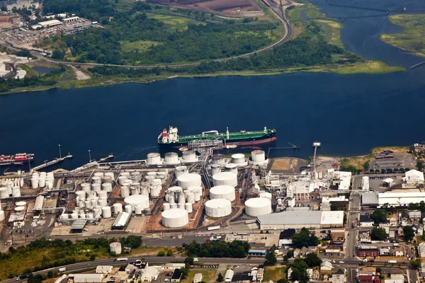 Stock image Oil farm with river