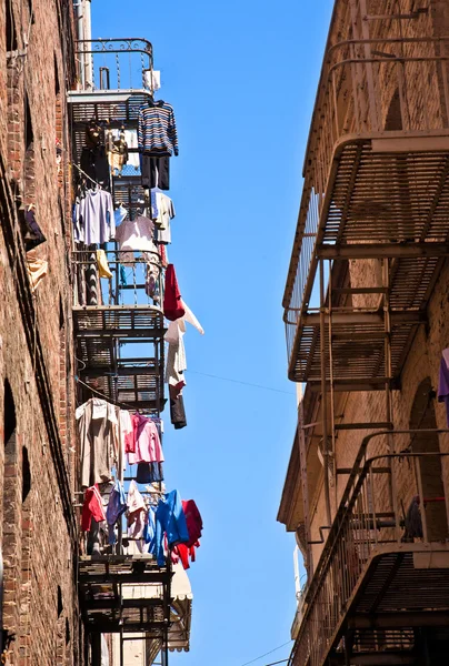 Iron fire escape is used for drying clothes — Stock Photo, Image