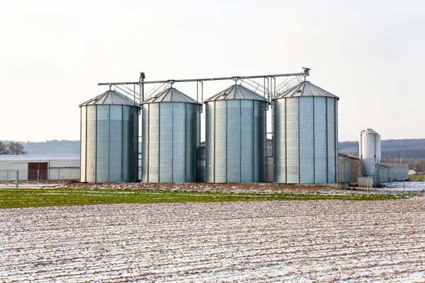 Acres with snow in winter with silo in beautiful light and struc — Stock Photo, Image