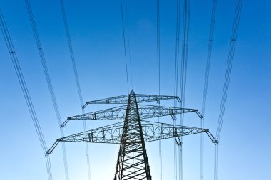 Electricity tower with blue sky clipart