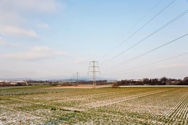 Acres con nieve en invierno con torre eléctrica —  Fotos de Stock