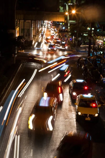 Light beam at night from cars at the main road — Stock Photo, Image