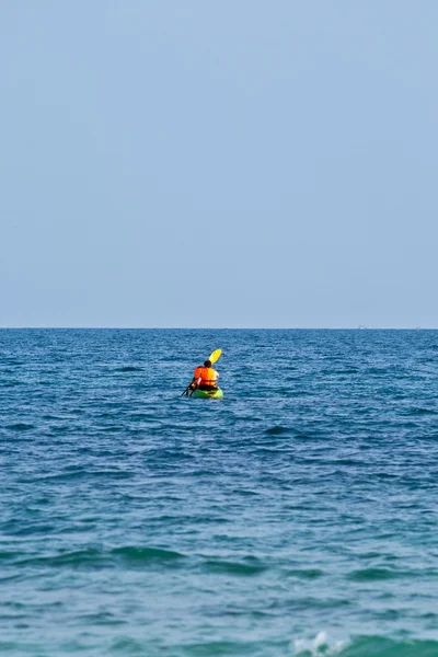 Father and son are padelling with a canoe on open sea — Stock Photo, Image