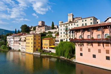 View of the romantic village Basano del Grappa over the river Br clipart