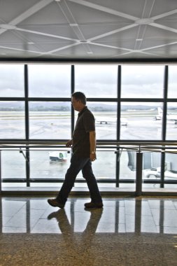 Man waiting at the departure hall