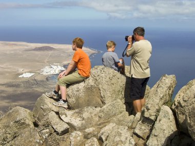 Father takes pictures from Balcon de Femes with his children in clipart