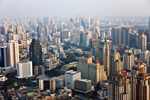 View across Bangkok skyline showing office blocks and condominiums