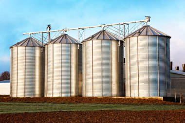 Silo in beautiful landscape clipart