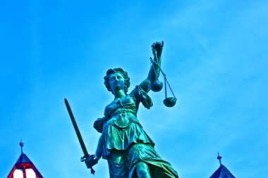 Statue of Lady Justice in front of the Romer in Frankfurt - Germ clipart