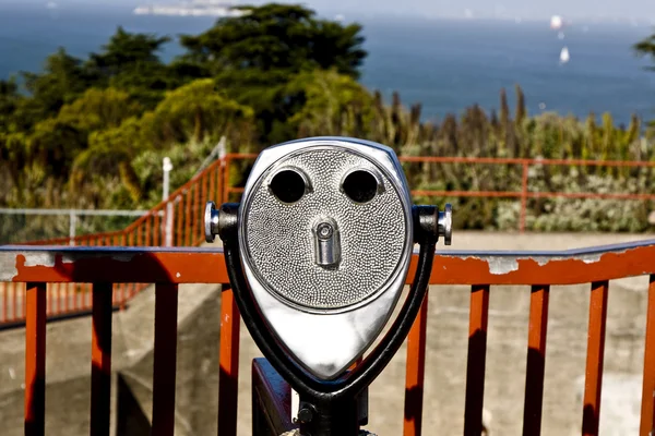 stock image Binoculars at the golden gate bridge are formed like a face