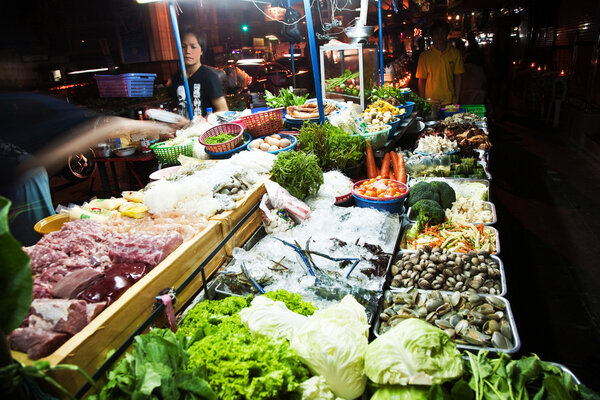 Fresh fish and vegetables are offered at the night market