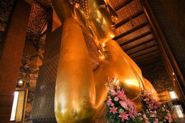 Famous lying buddha in temple Wat Pho in Bangkok clipart