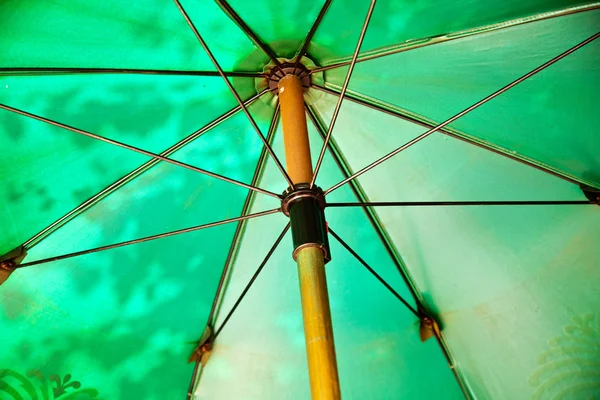 Open umbrella to protect against sun — Stock Photo, Image