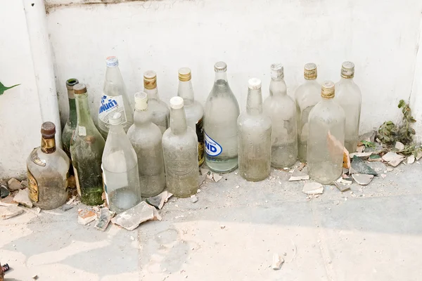 Empty bottles in a temple, Still life, garbage — Stock Photo, Image