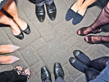 Shoes of party standing in a circle clipart