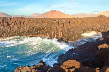 Los Hervideros, coastline with huge waves clipart