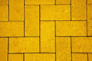 Pavement pattern made with cast concrete blocks in yellow color clipart