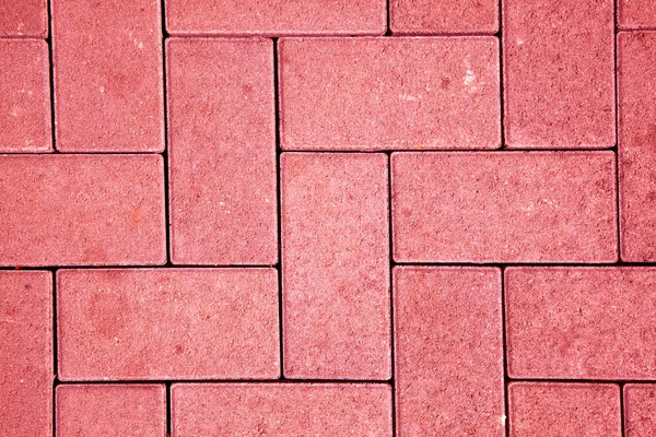 लाल रंग में कास्ट कंक्रीट ब्लॉक के साथ बनाया गया फुटपाथ पैटर्न — स्टॉक फ़ोटो, इमेज