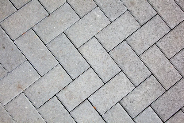 Pavement pattern made with cast concrete blocks in grey color Stock Image