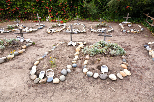 Cemetery of Carmel Mission with graves of indians decorated with shells