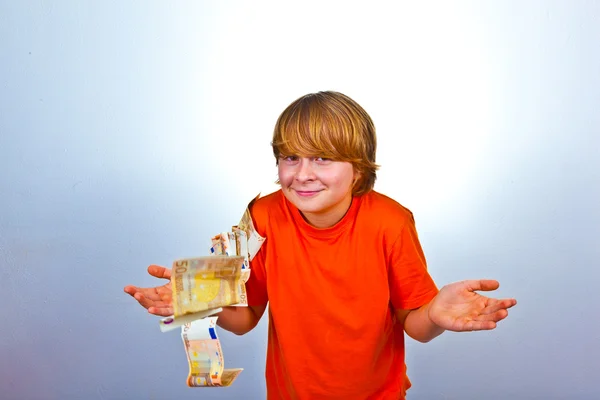 Stock image Euros flying around a boys head