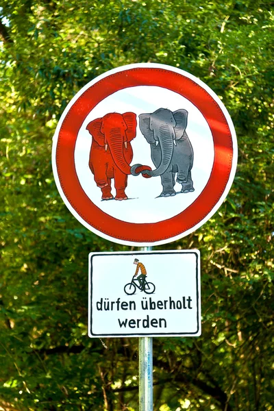 Sign forbidden for elefants in love and bicycle overtaking allow — Stock Photo, Image