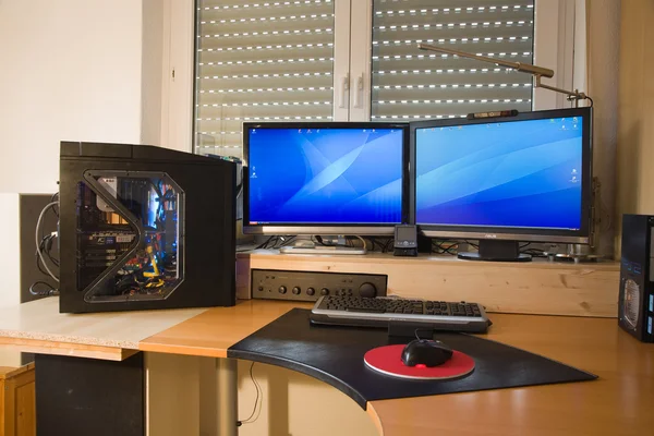 Stock image PC Personal computer with 2 flat screens, modding and picture of