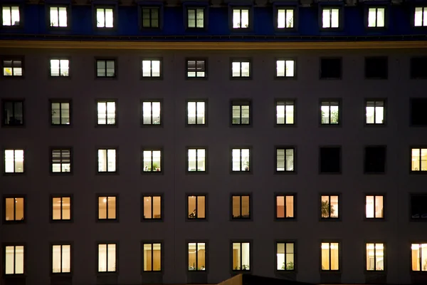 stock image Windows of a business house with light by night