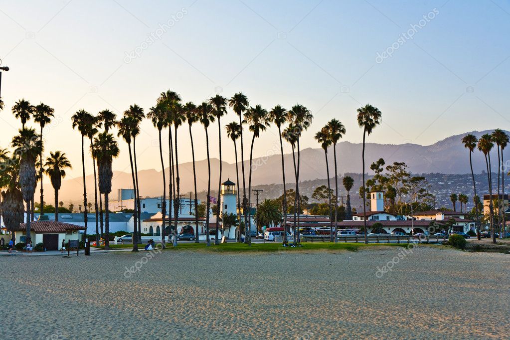 Scenic beach in Santa Barbara with palms in sunset