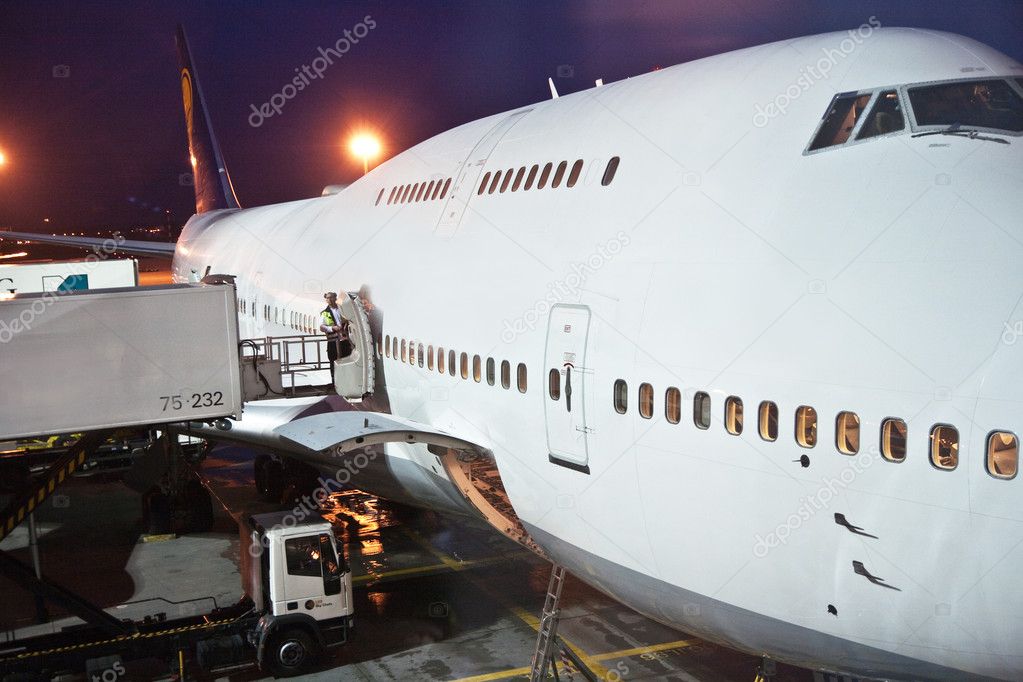 Aircraft loaded at the gate by night