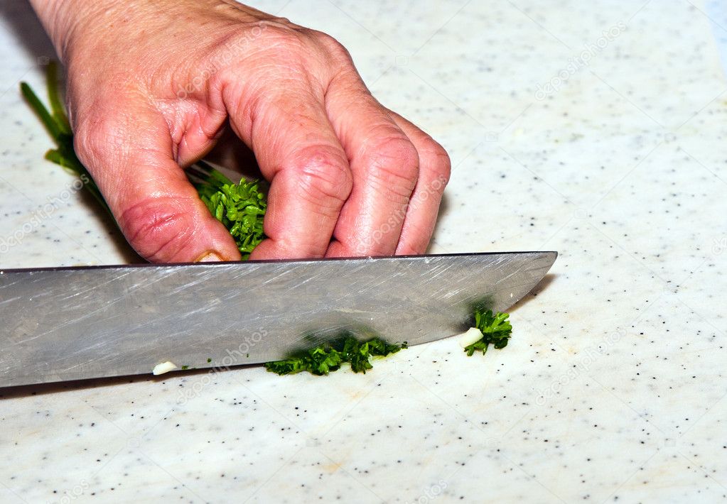 Cutting food with knife in the kitchen — Stock Photo © Hackman #5996887