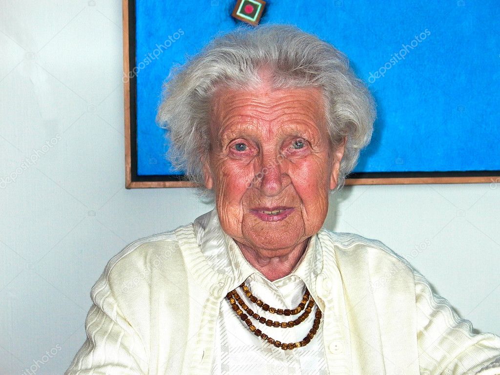 Elderly lady is very relaxed and looks happy