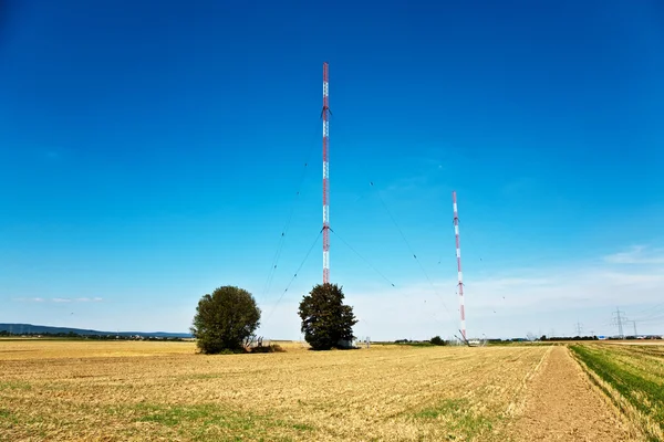 stock image Radio installation in golden acres with blue sky