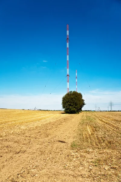 stock image Radio installation in golden acres with blue sky