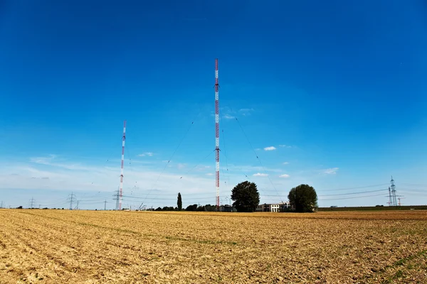 stock image Radio installation in golden acres with blue sky