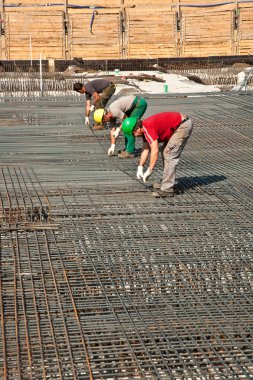 Workers are preparing the base plate clipart