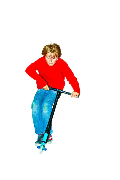 Niño saltando con su scooter — Foto de Stock