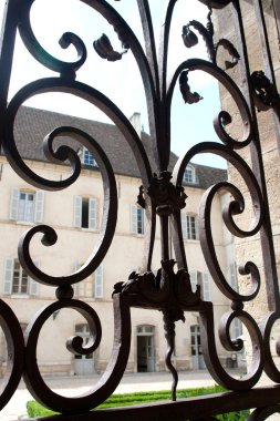 Window with iron window grate in famous hospice clipart