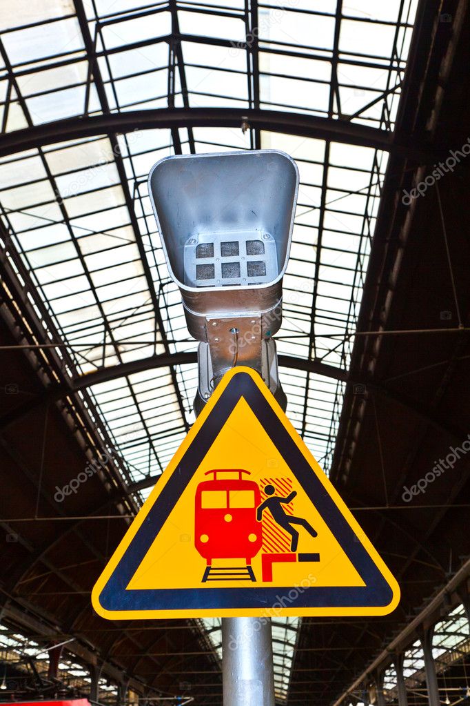 Warning sign and speaker in classicistical railway station