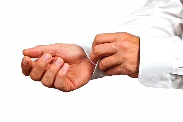 Man closing the sleeve of the white shirt — Stock Photo, Image
