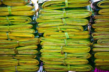 Palm leaves on the flower herbs market, early morning in Bangkok clipart