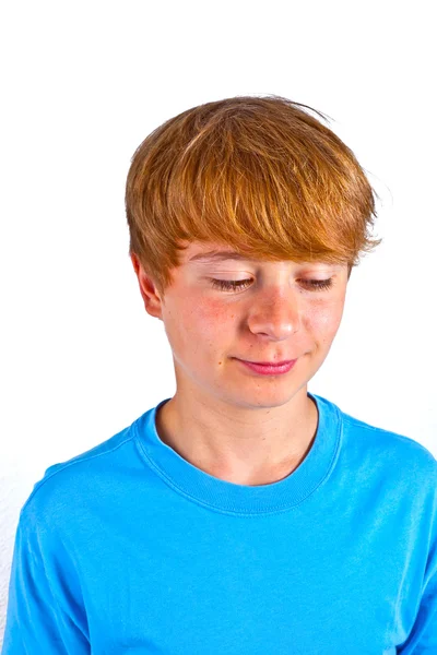 Portrait of happy boy with blue shirt in studio — Stock Photo, Image