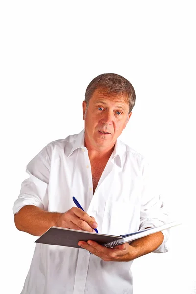Man schrijven in een boek — Stockfoto