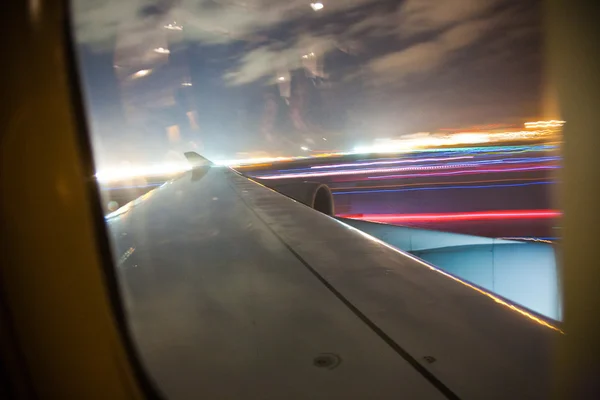 Aircraft starting by night seen from cabin — Stock Photo, Image