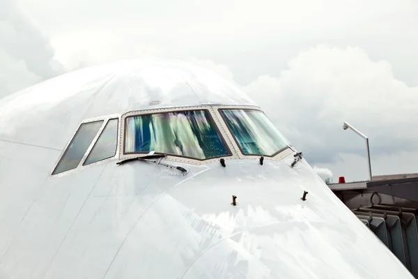 Stock image Detail of aircraft nose with cockpit window