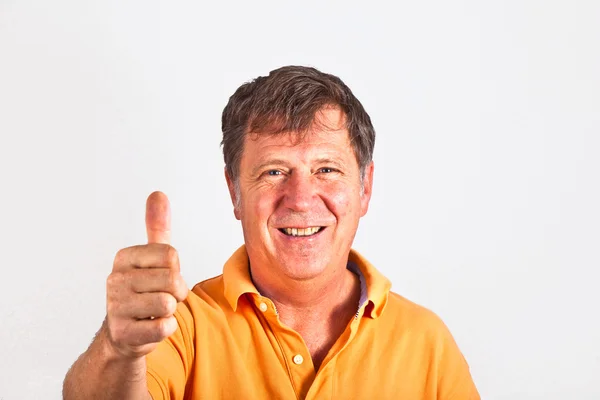 Attractive man giving finger sign — Stock Photo, Image