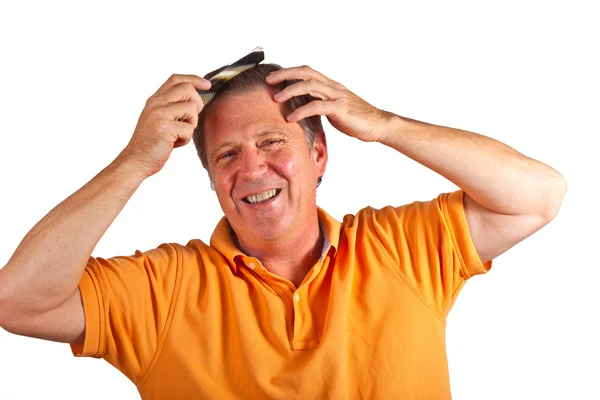 Attractive man combing his hair — Stock Photo, Image