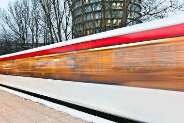 Train leaves the station early morning clipart